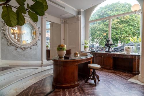 a large room with a table and a window at Hotel Bardot Boutique in Panama City