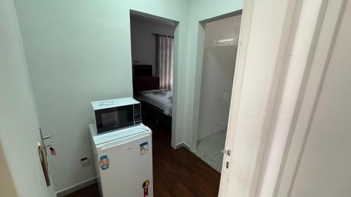 Ένα ή περισσότερα κρεβάτια σε δωμάτιο στο Hospedaria Vina Rio