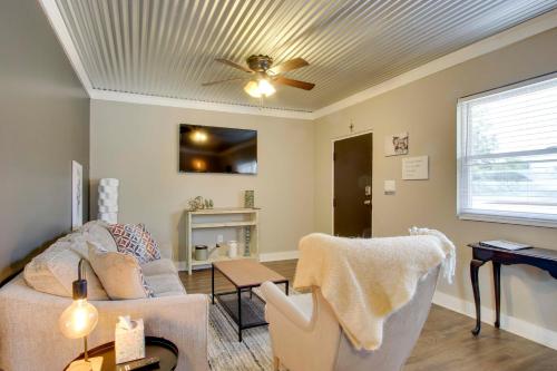 a living room with a couch and a ceiling fan at Close to Uptown and Hospital Greenwood Studio in Greenwood