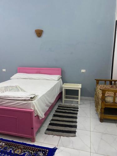 Ένα ή περισσότερα κρεβάτια σε δωμάτιο στο Hadi Guest House