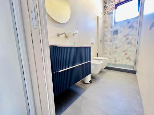 a bathroom with a sink and a toilet at "Sweet Life" Casa Vacanze in Lipari