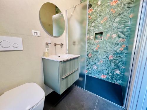a bathroom with a toilet and a sink and a shower at "Sweet Life" Casa Vacanze in Lipari