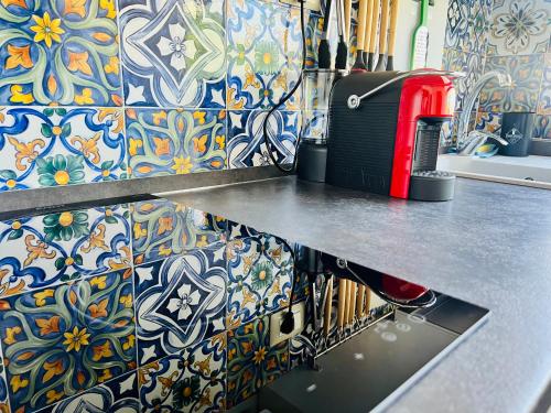 a kitchen with a counter top with a toaster on it at "Sweet Life" Casa Vacanze in Lipari