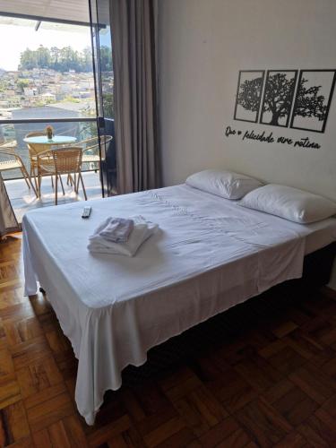 Ένα ή περισσότερα κρεβάτια σε δωμάτιο στο Loft Meu Cantinho