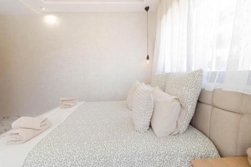 Ένα ή περισσότερα κρεβάτια σε δωμάτιο στο Cosy appartement lumineux