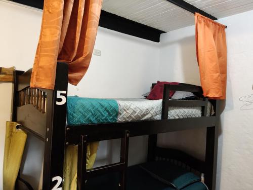 a bunk bed room with two bunk beds at Casa La Eliana in Salento