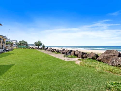 a view of the beach from the house at Palm Breeze - Hosted by Burleigh Letting in Gold Coast