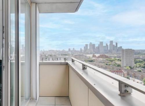 a balcony with a view of the city at London City View Apartment, short walk to Tower Bridge, Free Parking in London