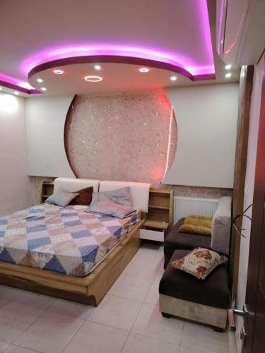 Ένα ή περισσότερα κρεβάτια σε δωμάτιο στο mraco apartment