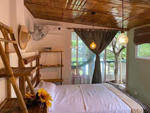 Giường trong phòng chung tại La Magia del Atardecer - Campesina