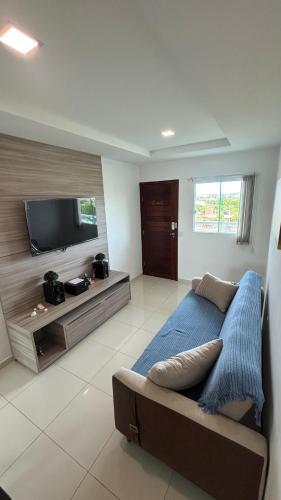 Televisyen dan/atau pusat hiburan di Apartamento Aconchego de Carapibus