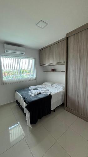 Katil atau katil-katil dalam bilik di Apartamento Aconchego de Carapibus