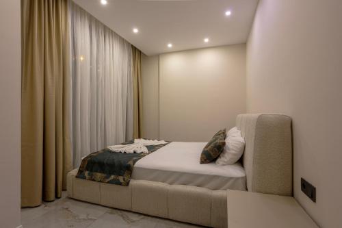 Katil atau katil-katil dalam bilik di Loovox Suites