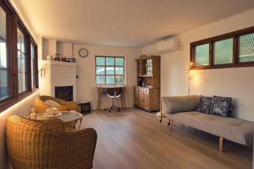 a living room with a couch and a table at Family Friendly Home Close To Beach & Gilleleje in Gilleleje