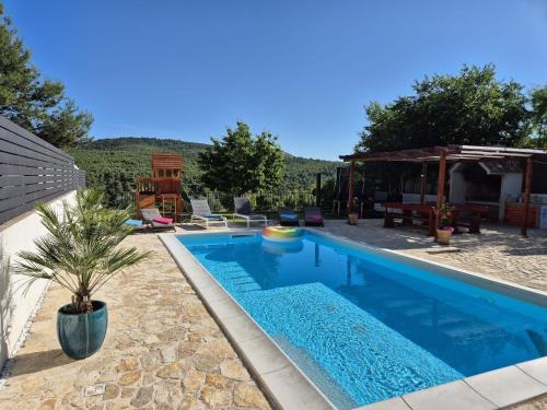Family friendly house with a swimming pool Vrpolje, Sibenik - 24345