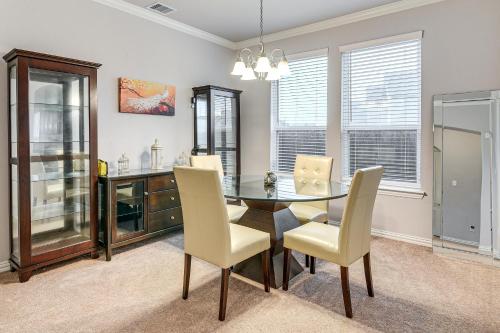 a dining room with a table and chairs at Grand Family Home with Patio and Fenced Yard in Arcola 