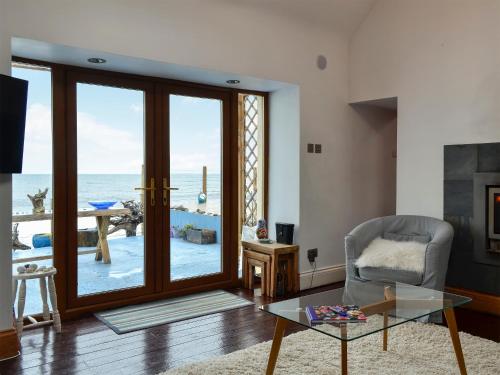 a living room with a view of the ocean at Sea Yonder in Buckie