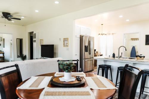 a kitchen and dining room with a table and chairs at The Berkeley House in Klamath Falls