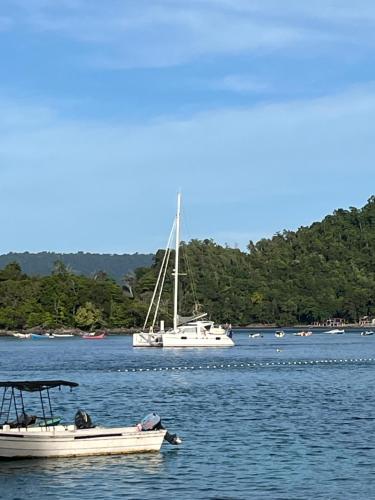 a couple of boats in a body of water at Olala Bungalows and Restaurant in Sabong