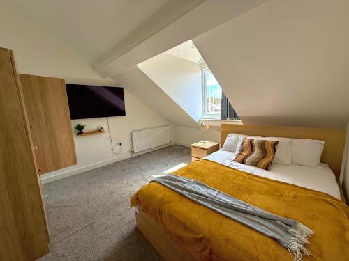 a bedroom with a large bed in a attic at The Mayfair Residence