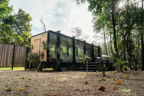 a house sitting in the middle of a yard at Coastal Bliss New Brighton Eco Pod 50m to Beach in New Brighton