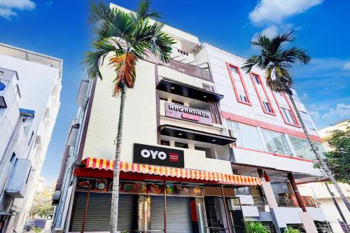 a palm tree in front of a building at SPOT ON Nagananda Residency in Bengaluru