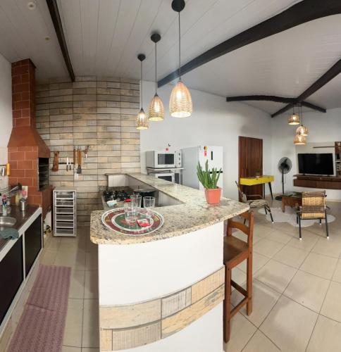 a kitchen with a large island in the middle of a room at Casa Brisa in Sinop