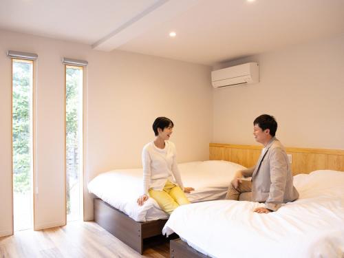Ένα ή περισσότερα κρεβάτια σε δωμάτιο στο saunea白州