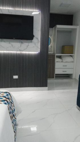Letto o letti in una camera di Apartamento Amueblado Caribe, Santo Domingo a 10 minutos del Aeropuerto Internacional de las Americas