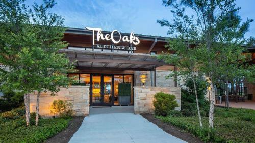 a building with a sign that reads the oxleys chiropractor center at Ultimate Getaway Explore Katy & Houston in Style in Katy