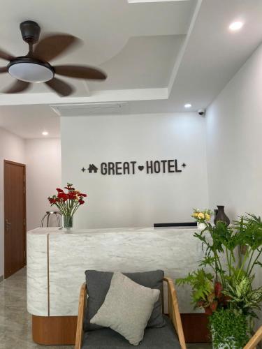 a lobby with a great hotel sign on the wall at Great Hotel Phú Quốc in Phu Quoc