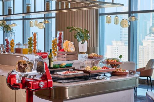 a buffet in a hotel with food on a table at MaxX by Steigenberger Harbour-view Qingdao in Qingdao