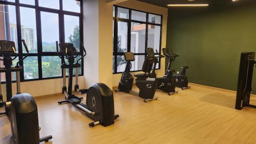 a gym with a row of exercise bikes in a room at CasaZlyn Studio By MySky Stays at Presint 5, Putrajaya in Putrajaya