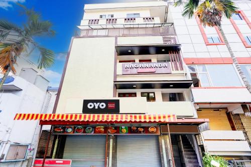 a building with an ovo sign on the front of it at SPOT ON Nagananda Residency in Bengaluru