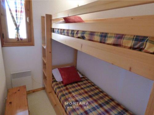 a bedroom with two bunk beds in a room at Charmant studio avec cabine - 4 pers - St Jean de Sixt - FR-1-458-223 in Saint-Jean-de-Sixt