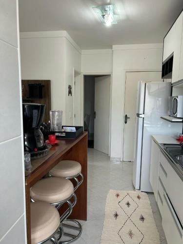 Kuchyň nebo kuchyňský kout v ubytování Ap Ubatuba