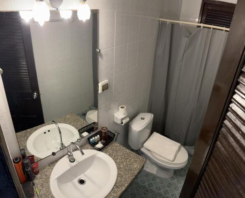 a bathroom with a sink and a toilet and a mirror at Istanbul Boutique Hotel in Patong Beach