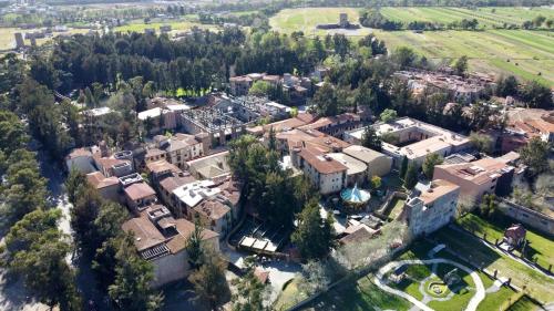 an aerial view of a large house with trees at Pisa en ValQuirico in Santeagueda