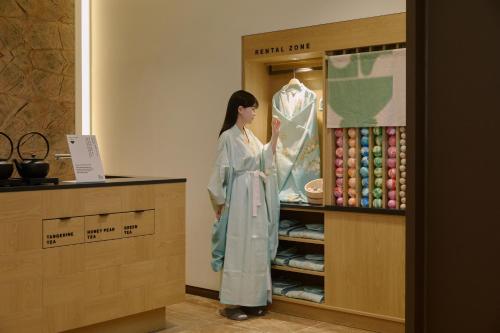 a statue of a woman in at Aank Ryokan Hotel Songtan in Pyeongtaek