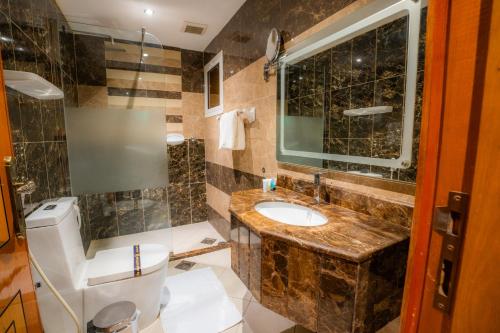 a bathroom with a sink and a toilet at بيت الضيافة in Jeddah