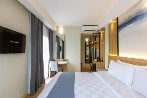 Кровать или кровати в номере Best Western Setiabudhi Bandung