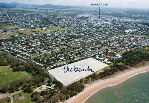 an aerial view of the beach with the baseball sign at Petrie Beach Holiday Home in Mackay