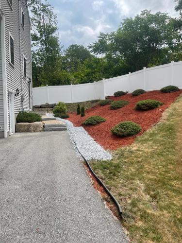 a house with a white fence and a garden at Elegant 3BR Home in Worcester in Worcester