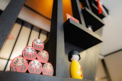 a group of eggs with a rubber duck on a shelf at 新大阪旅庵 民泊彩庵 Saian-Japanese Townhouse 3min to Higashi-Mikuni Station Near Shin-Osaka in Osaka