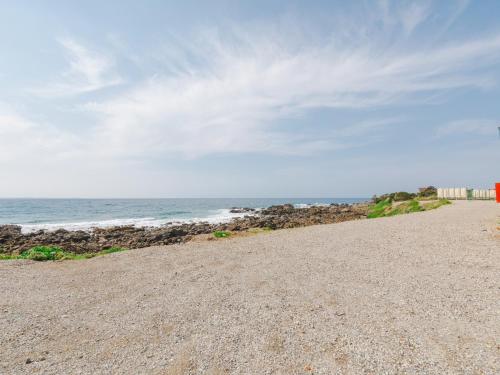 a rocky beach with the ocean in the background at 住吉ビレッジ種子島 in Yokino