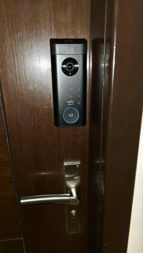 a door with a lock on a wooden door at 1BR BGC Uptown Modern Condo Netflix 200Mb Wifi in Manila