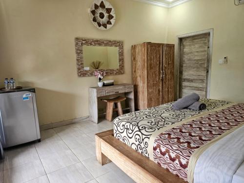 Postel nebo postele na pokoji v ubytování Bale Bali Inn