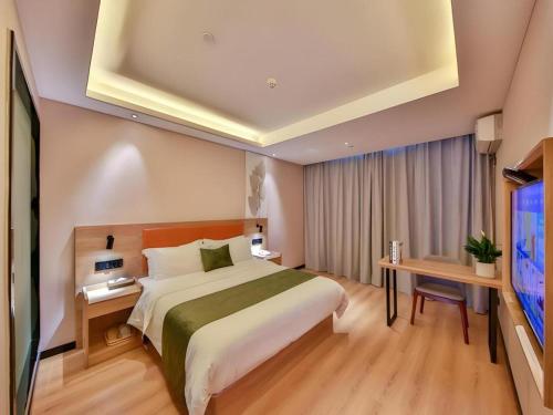 Ένα ή περισσότερα κρεβάτια σε δωμάτιο στο Green Tree Inn Express Zhejiang Zhoushan Xincheng Zheda