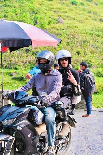 a man and a woman riding on a motorcycle at Loop Central Stay Tour & Motorbike Rental in Ha Giang