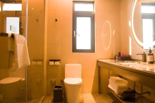 Ένα μπάνιο στο Echeng Hotel Enshi Minzu Road